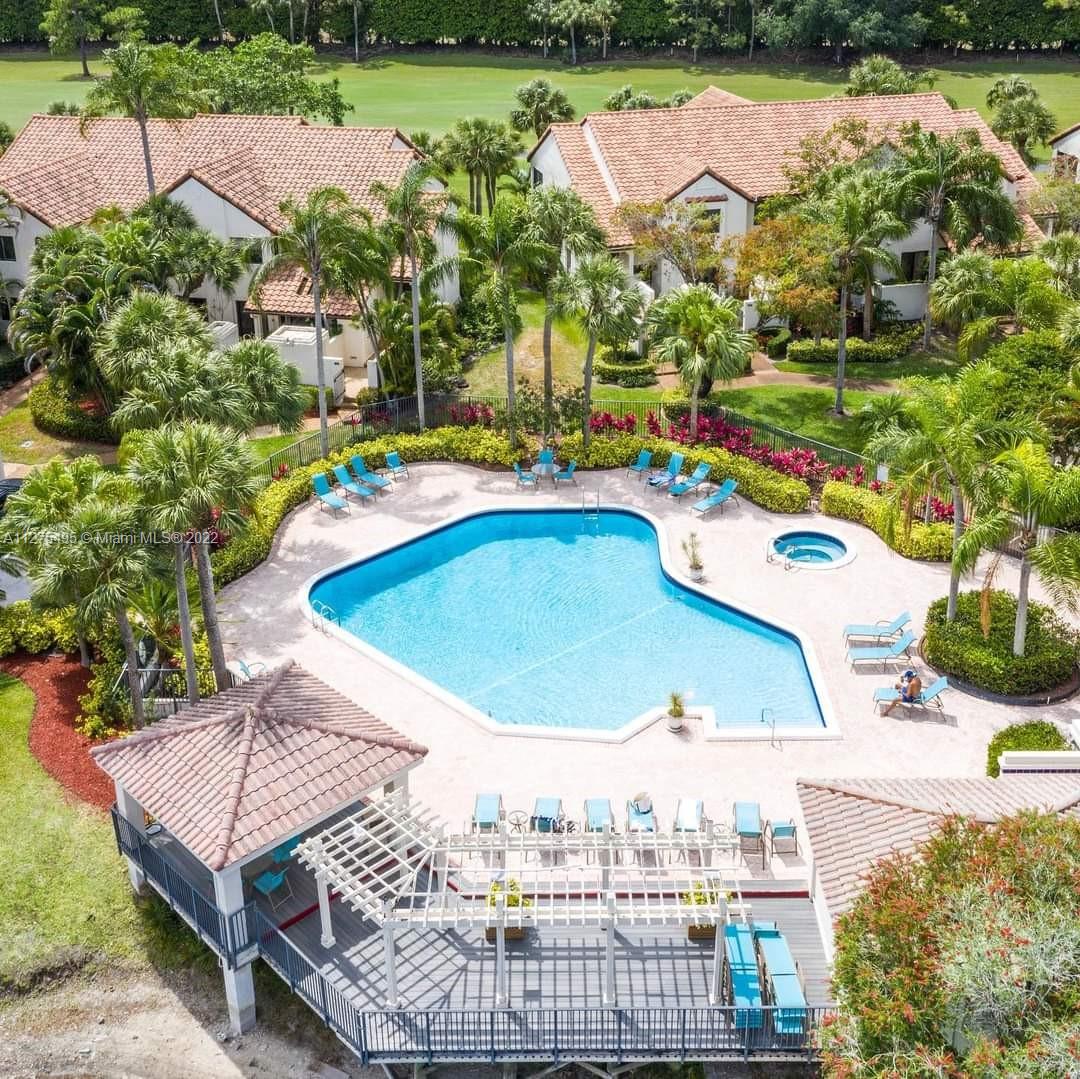 7896 Seville Place, Unit 1501 Boca Raton, FL 33433 - Photo 9 of 9 a view of a swimming pool with a patio
