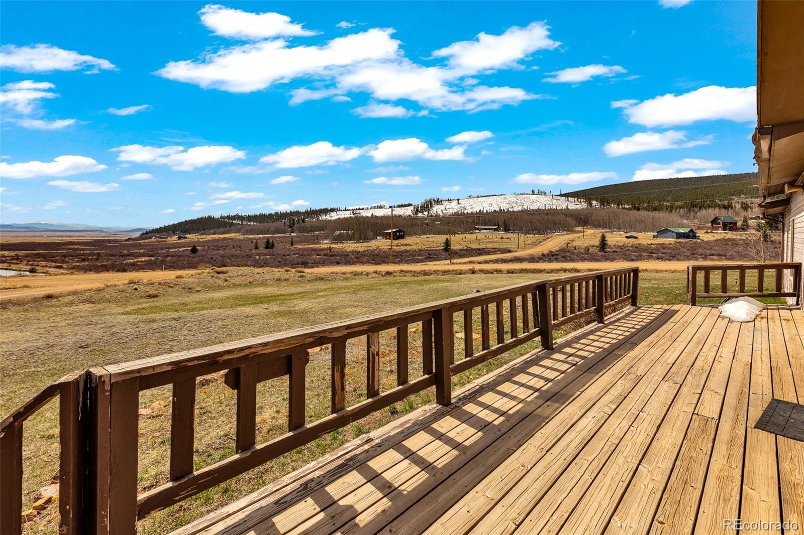 37 Warm Springs Road Fairplay, CO 80440 - Photo 12 of 50 a view of a balcony with wooden floor and city view