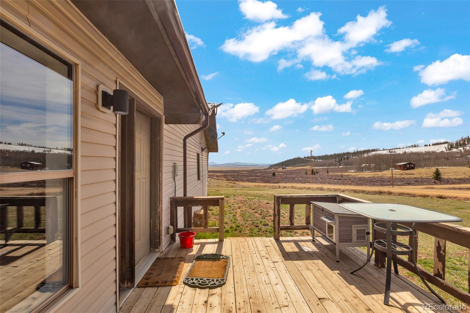 37 Warm Springs Road Fairplay, CO 80440 - Photo 13 of 50 a view of a terrace with wooden floor and city view