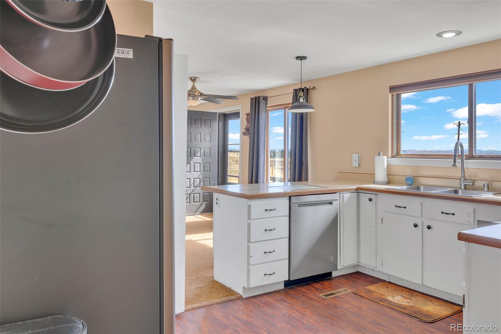 37 Warm Springs Road Fairplay, CO 80440 - Photo 21 of 50 a spacious bathroom with a granite countertop sink and a mirror
