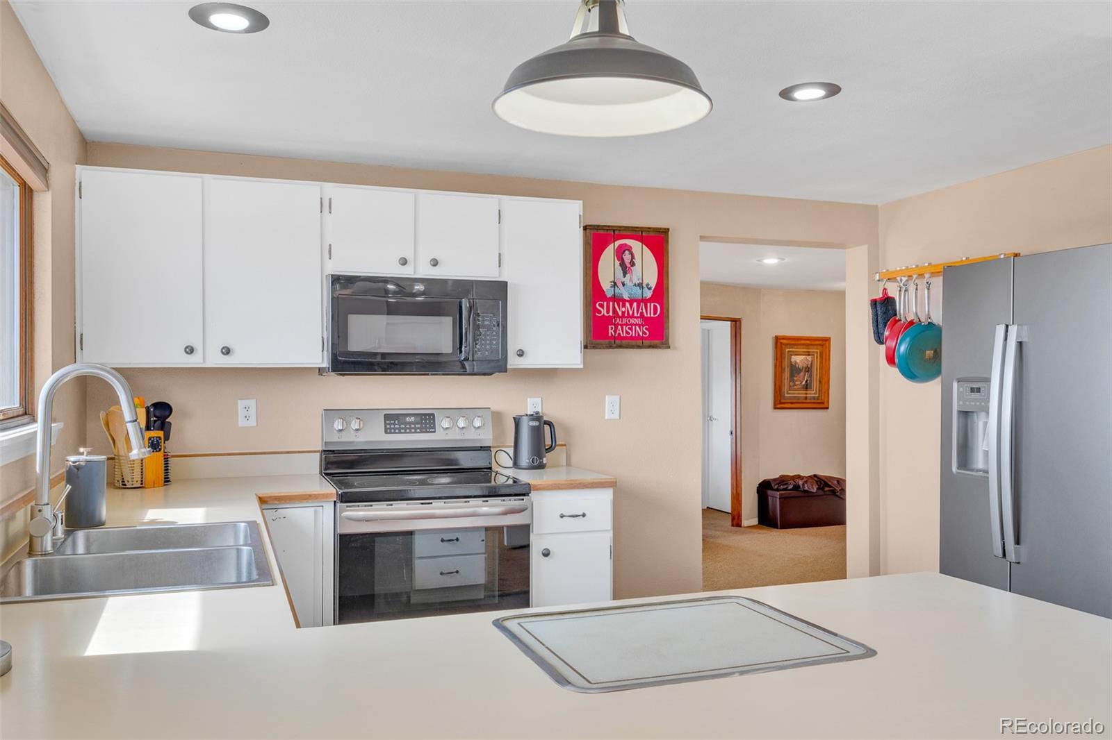 37 Warm Springs Road Fairplay, CO 80440 - Photo 24 of 50 a kitchen with stainless steel appliances a stove a sink and a refrigerator