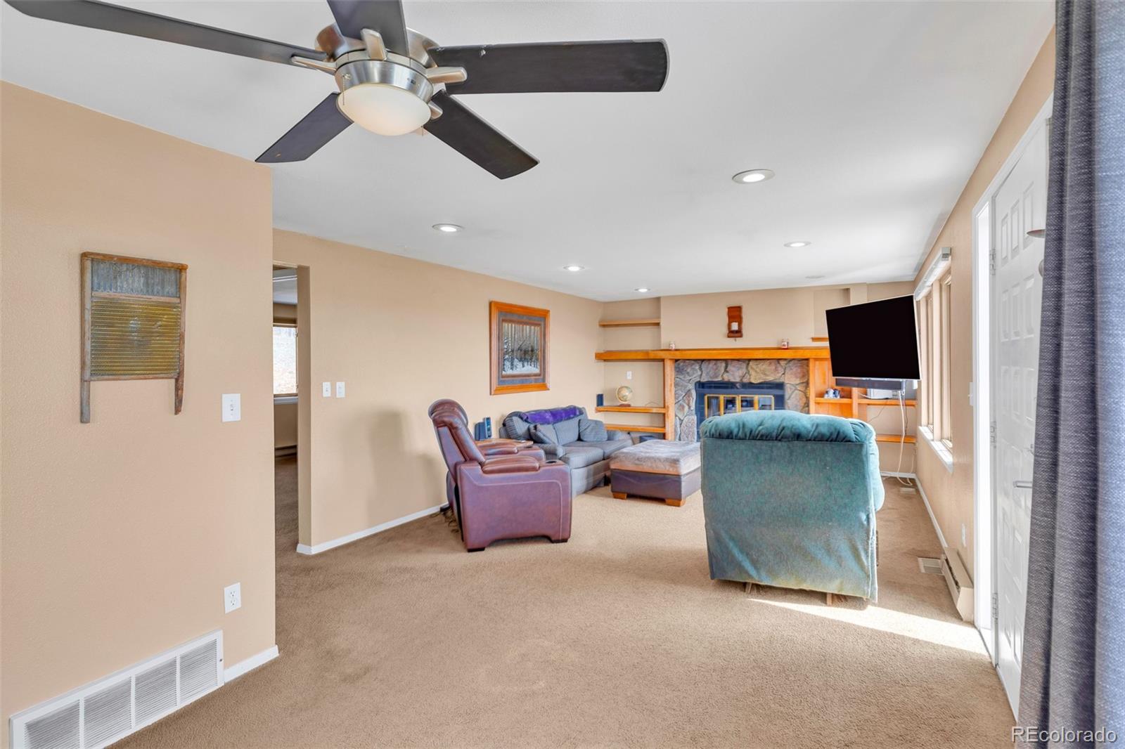 37 Warm Springs Road Fairplay, CO 80440 - Photo 26 of 50 a living room with furniture a ceiling fan and a window