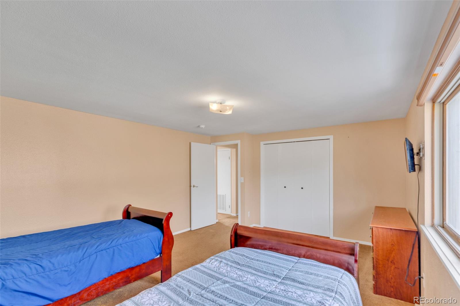 37 Warm Springs Road Fairplay, CO 80440 - Photo 31 of 50 a bedroom with bed and wooden floor