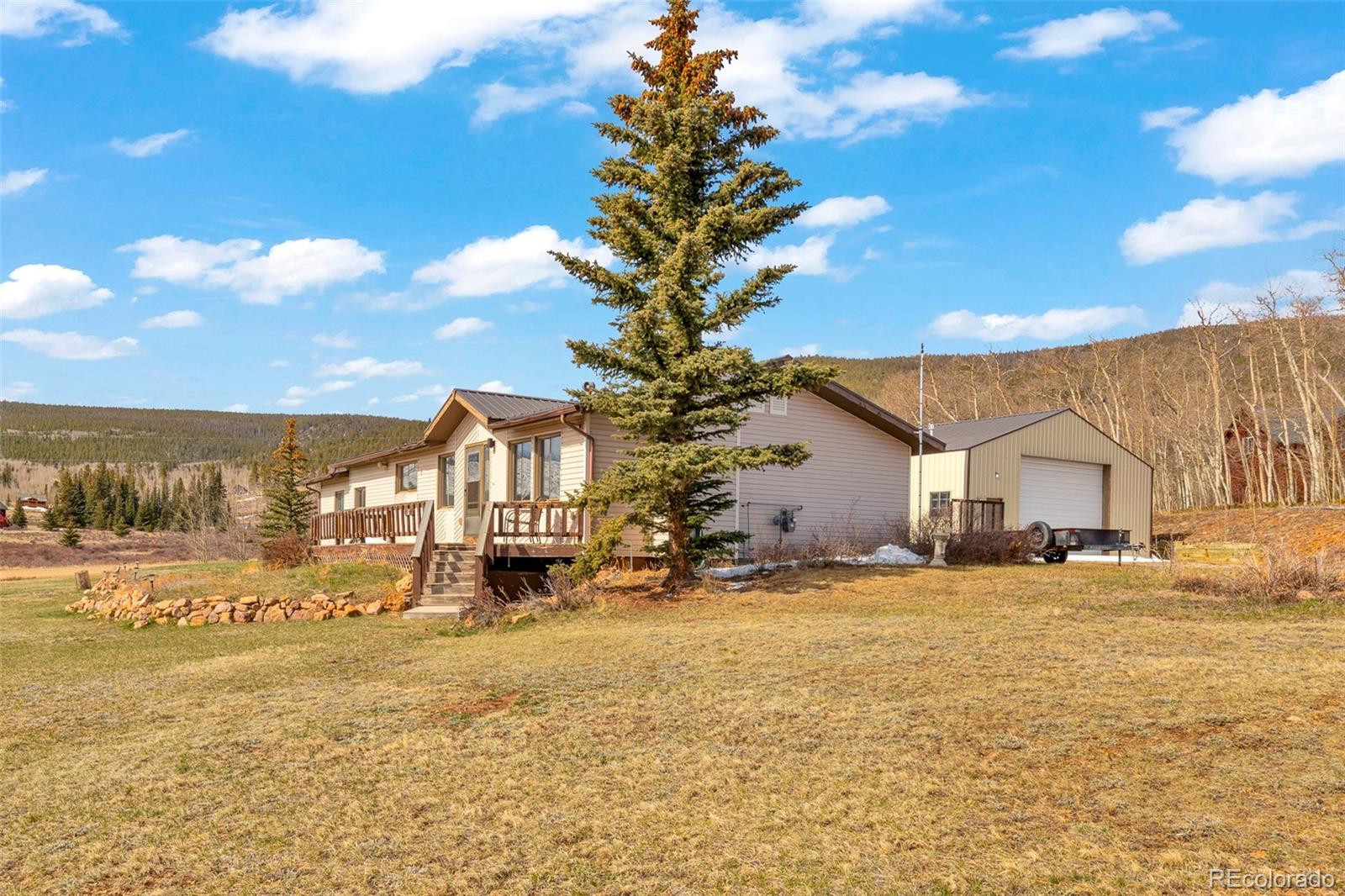 37 Warm Springs Road Fairplay, CO 80440 - Photo 7 of 50 a front view of a house with a yard