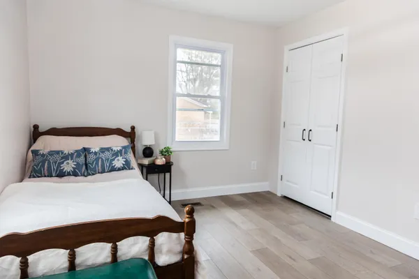 a bedroom with a bed and a table in it