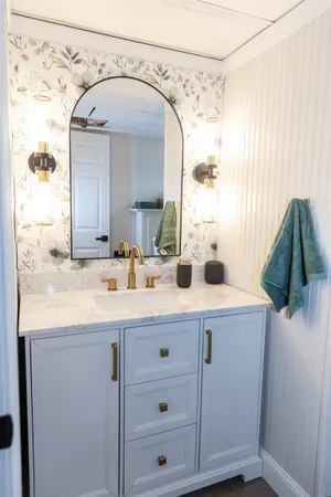 a bathroom with a sink and a mirror