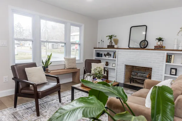 a living room with furniture and a fireplace