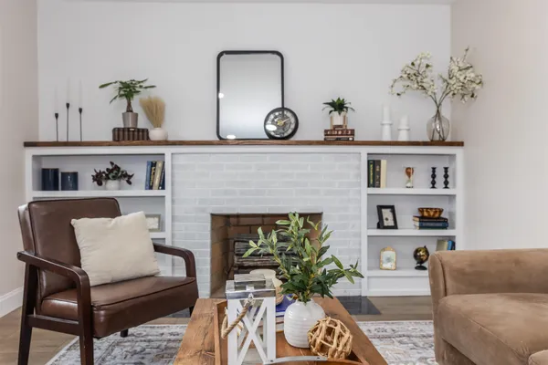 a living room with furniture and a fireplace