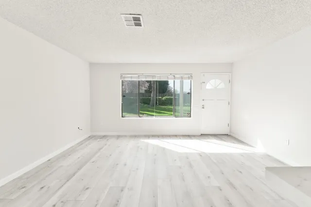 a hallway with a sink a washer and dryer