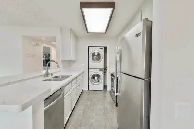 a kitchen with a stove and a sink