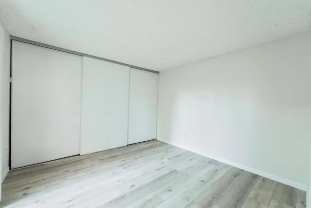 a bedroom with a bed and a table in it