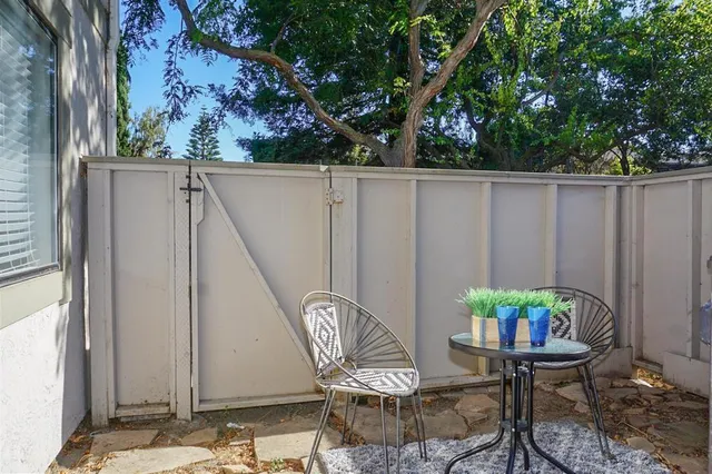 a view of a chair and table in the balcony
