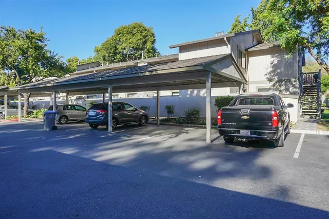 a view of kitchen with wooden floor and electronic appliances