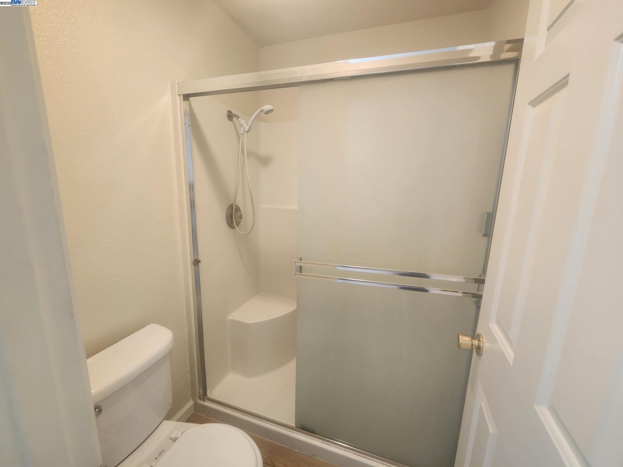 2255 Chestnut Street, Unit 12 Livermore, CA 94551 - Photo 17 of 17 a bathroom with a shower and a toilet