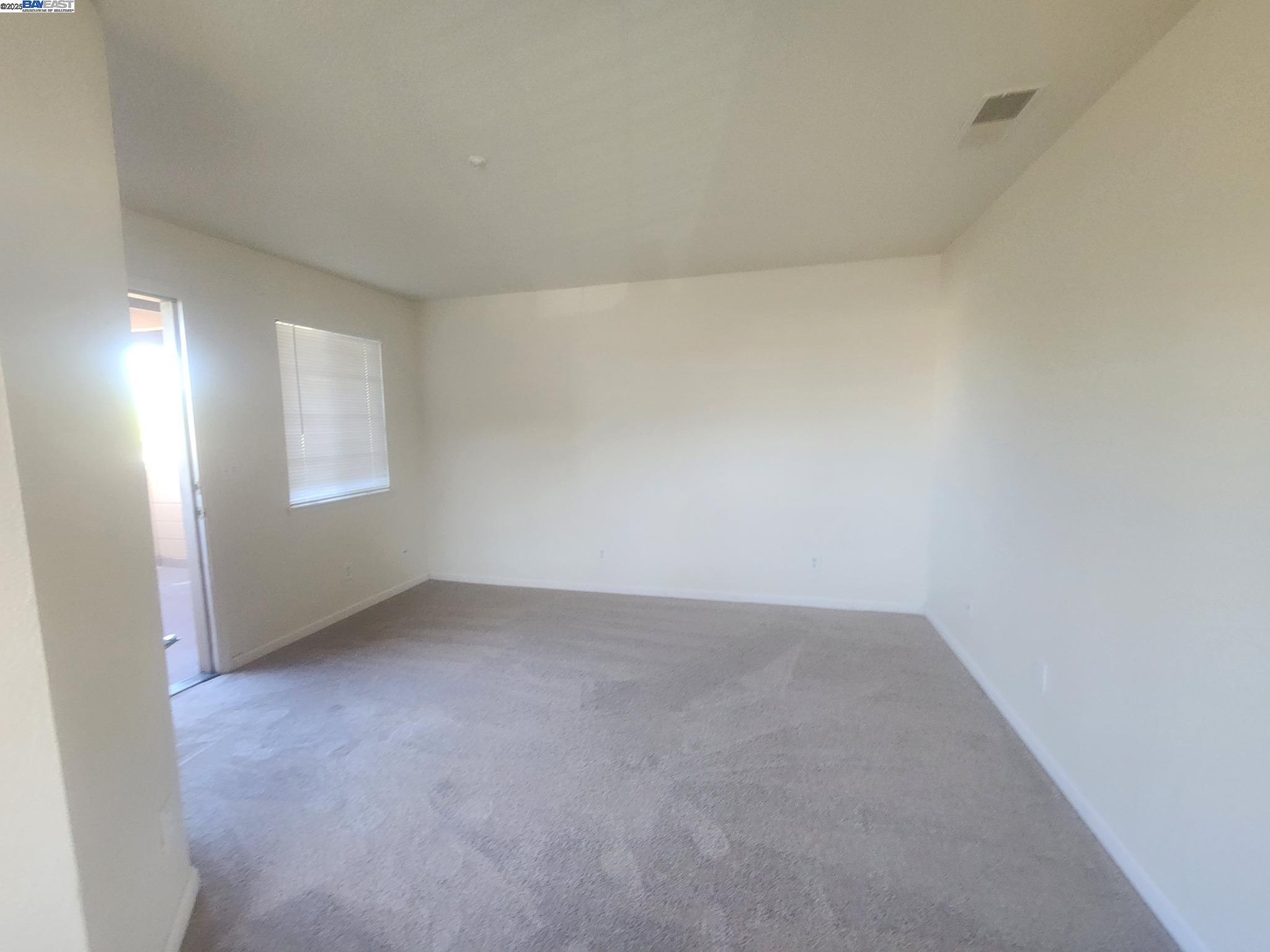 2255 Chestnut Street, Unit 12 Livermore, CA 94551 - Photo 5 of 17 an empty room with windows