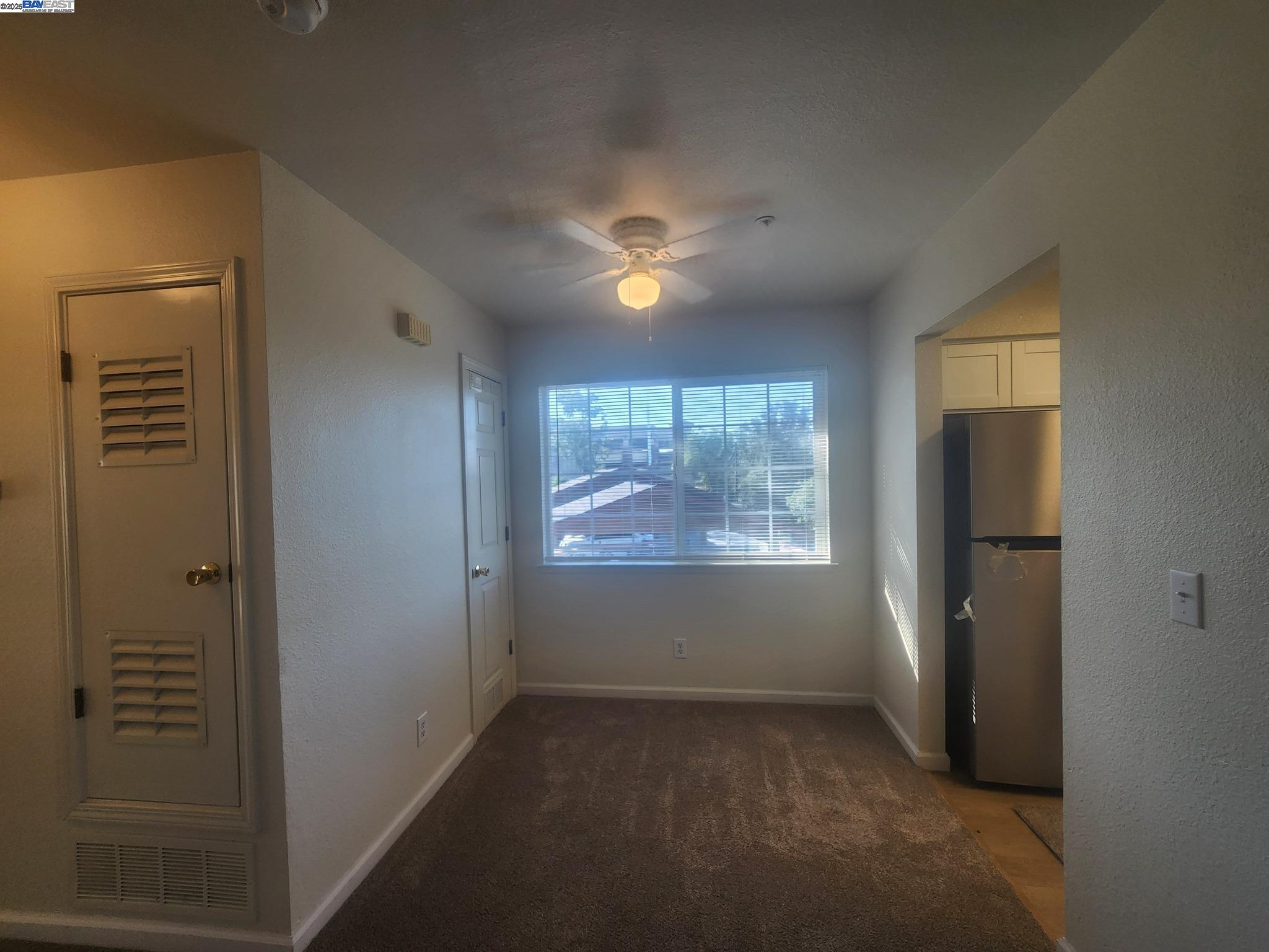 2255 Chestnut Street, Unit 12 Livermore, CA 94551 - Photo 7 of 17 an empty room with windows and closet