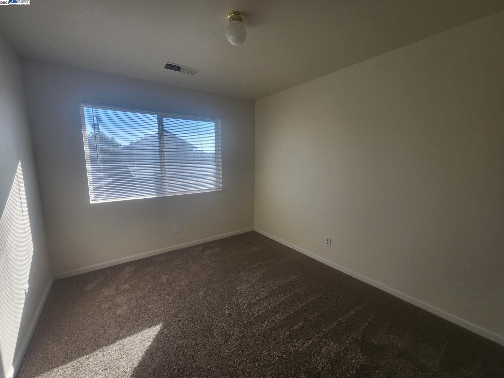 2255 Chestnut Street, Unit 12 Livermore, CA 94551 - Photo 9 of 17 an empty room with a window