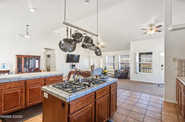 a kitchen with a stove and a wooden cabinets