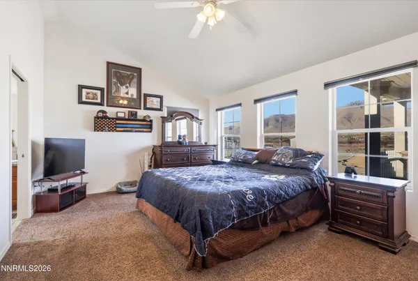 a bedroom with a bed and furniture