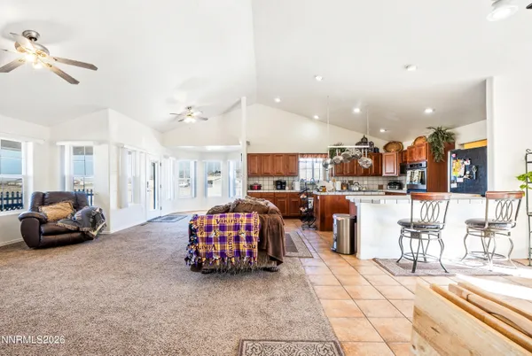 a living room with furniture a table and chairs