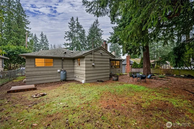 a view of house with trees in front of it