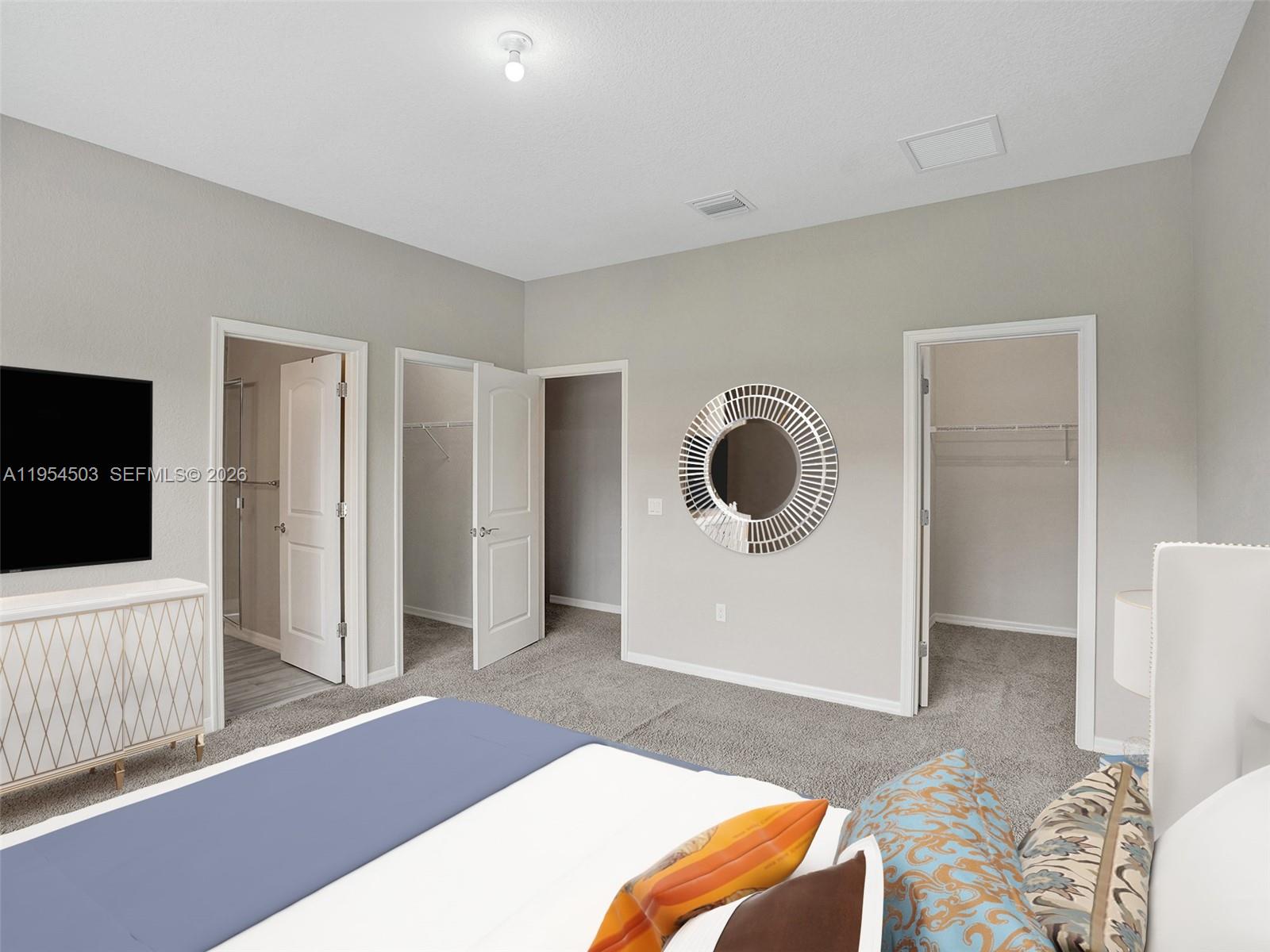 8330 Rearing Lane Lake Worth, FL 33467 - Photo 14 of 39 a bedroom with a bed and a television in it