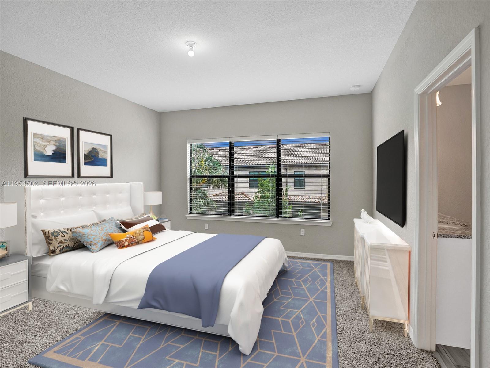 8330 Rearing Lane Lake Worth, FL 33467 - Photo 15 of 39 a bedroom with a bed and a flat screen tv