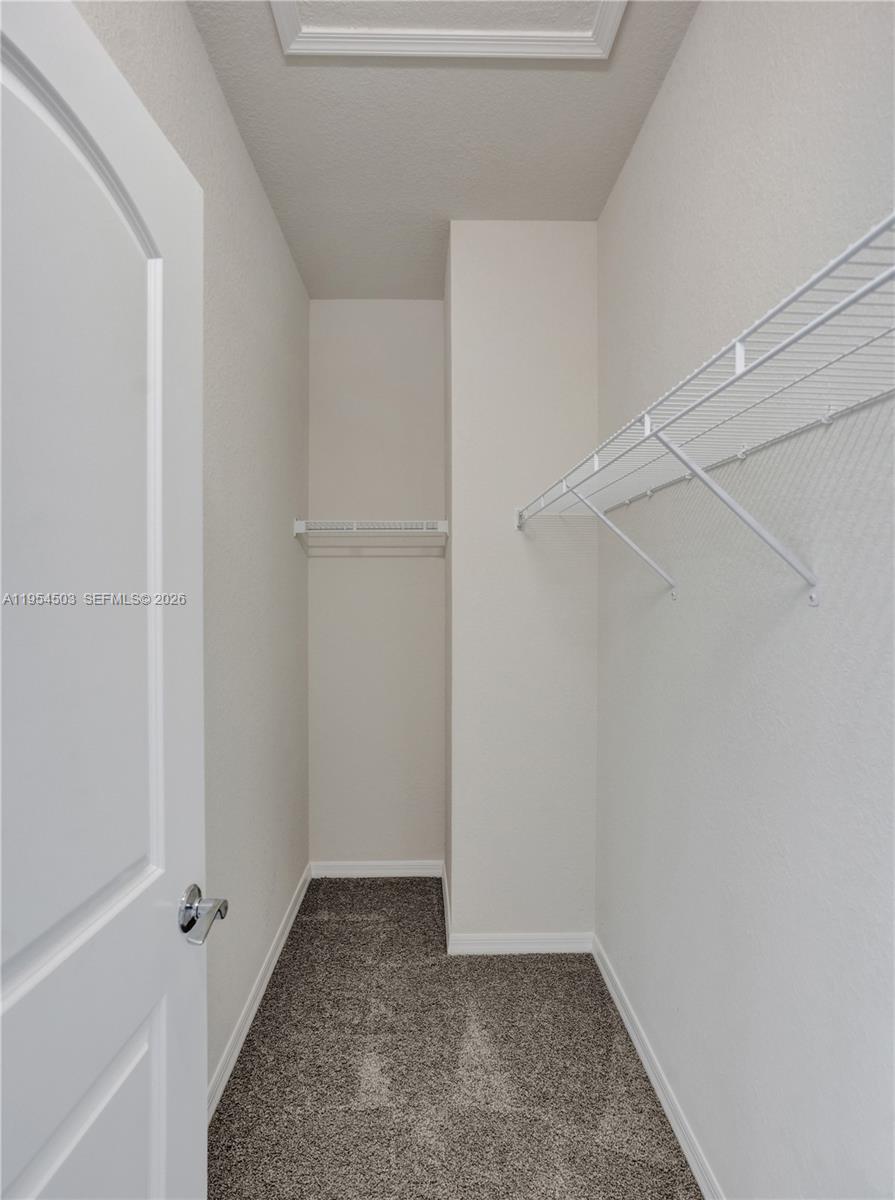8330 Rearing Lane Lake Worth, FL 33467 - Photo 19 of 39 a view of room with walk in closet
