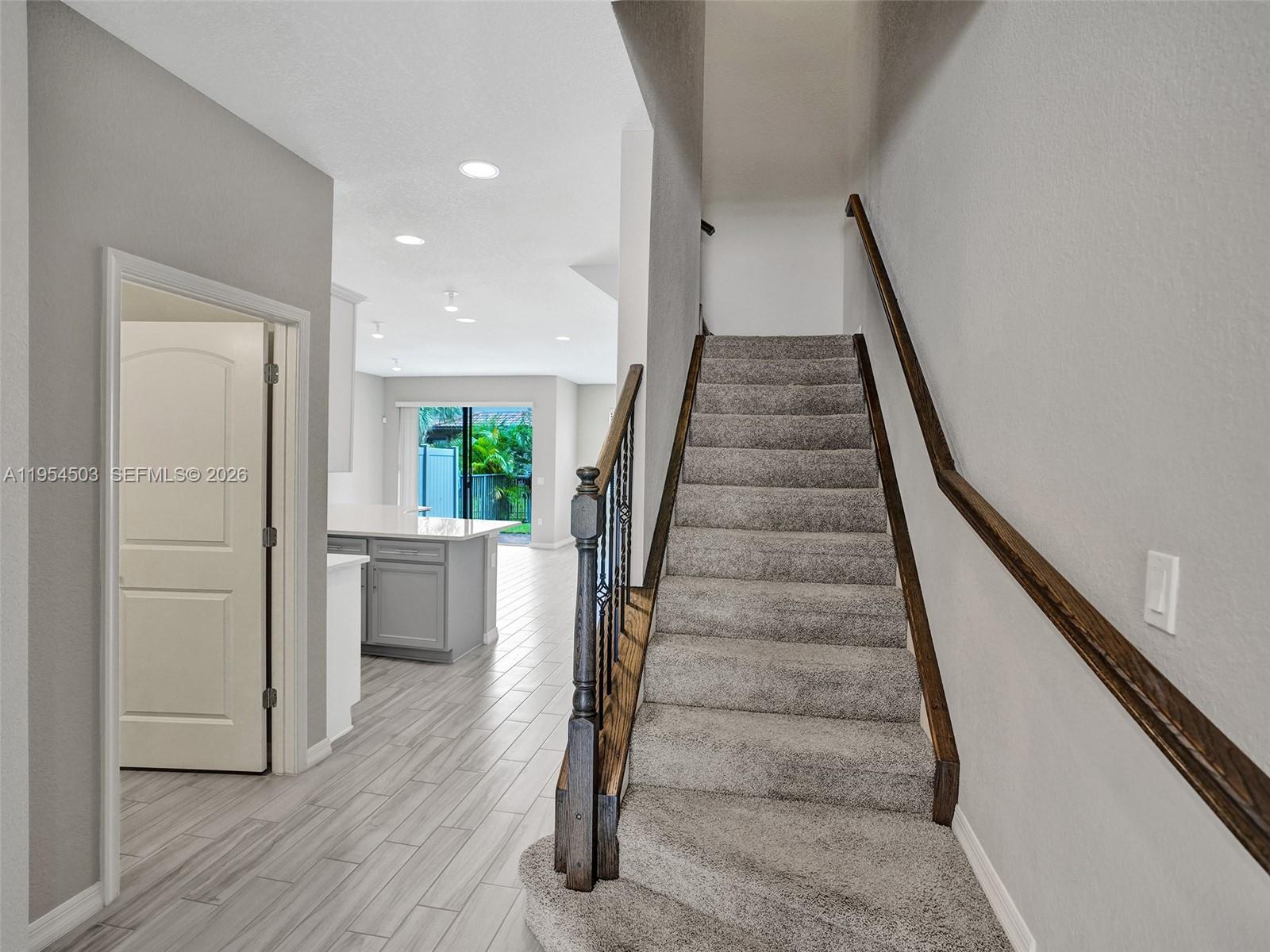 8330 Rearing Lane Lake Worth, FL 33467 - Photo 2 of 39 a view of entryway and hall with wooden floor