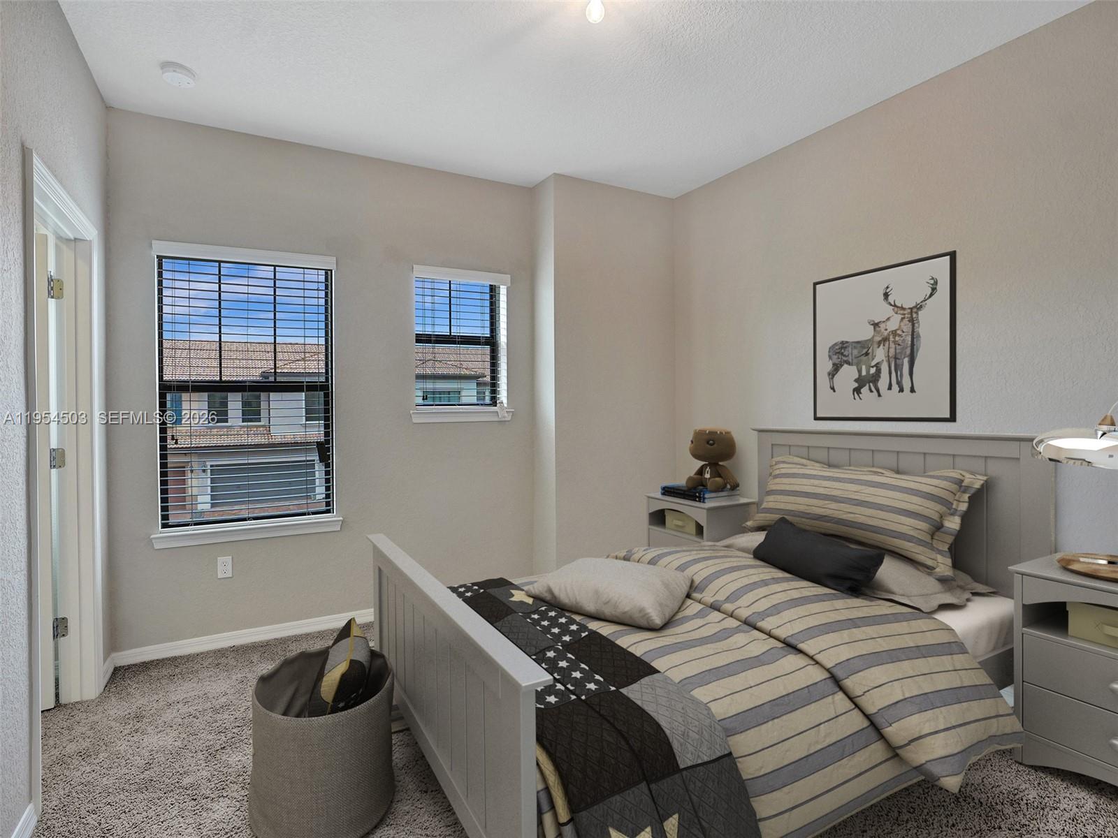 8330 Rearing Lane Lake Worth, FL 33467 - Photo 22 of 39 a bedroom with a bed and wooden floor