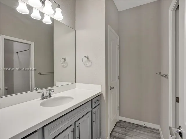 a white toilet sitting next to a bath tub