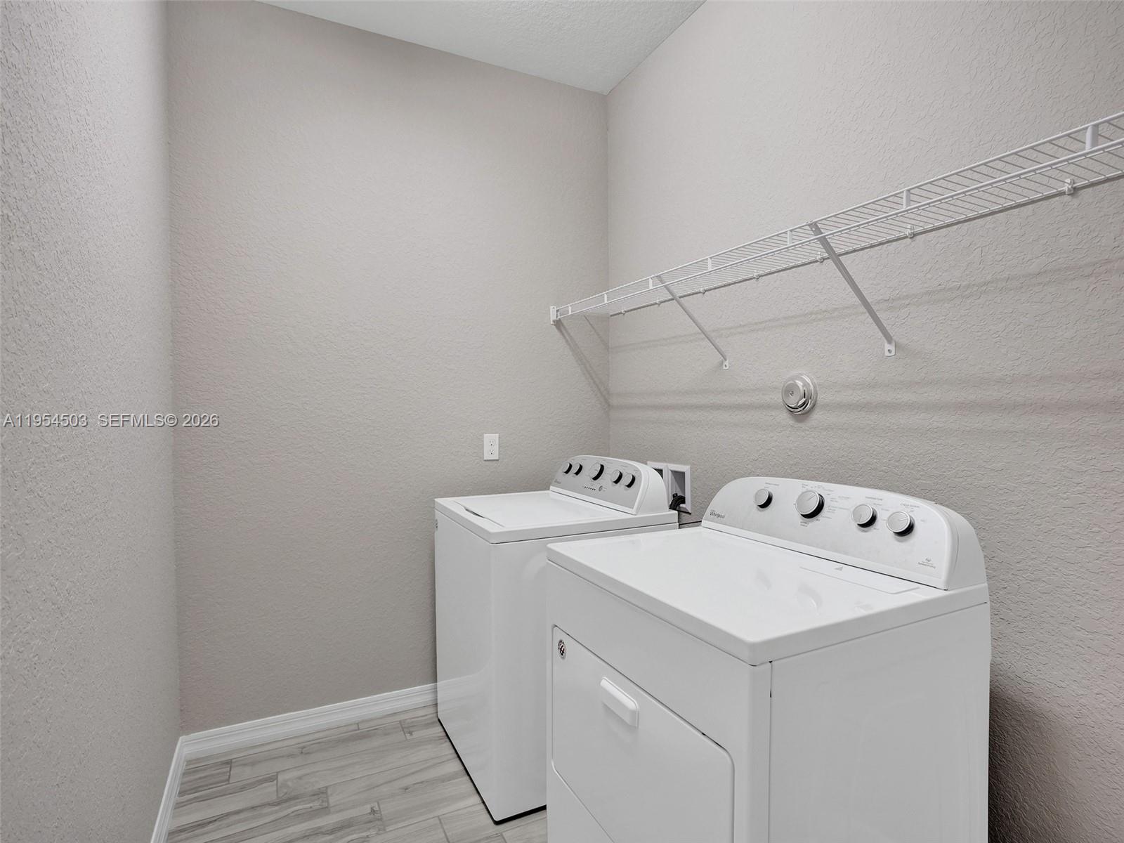 8330 Rearing Lane Lake Worth, FL 33467 - Photo 30 of 39 a utility room with dryer and washer