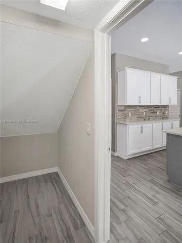 a view of kitchen with wooden floor