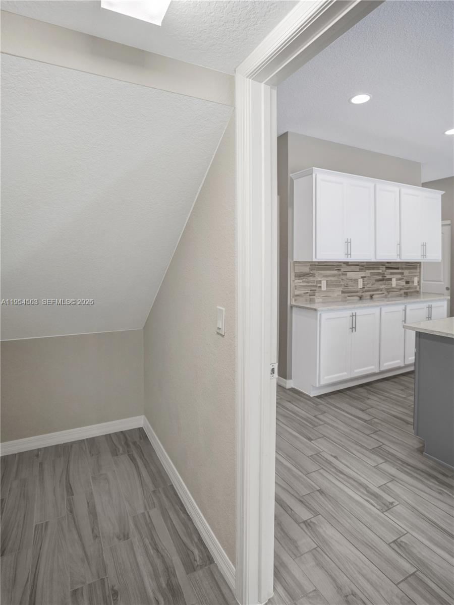 8330 Rearing Lane Lake Worth, FL 33467 - Photo 10 of 39 a view of kitchen with wooden floor