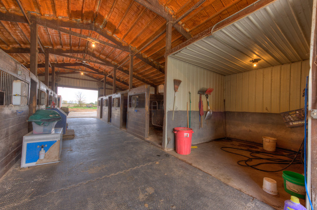 546 East Munz Road Crete, IL 60417 - Photo 3 of 16 a garage with red wall paint and a sink