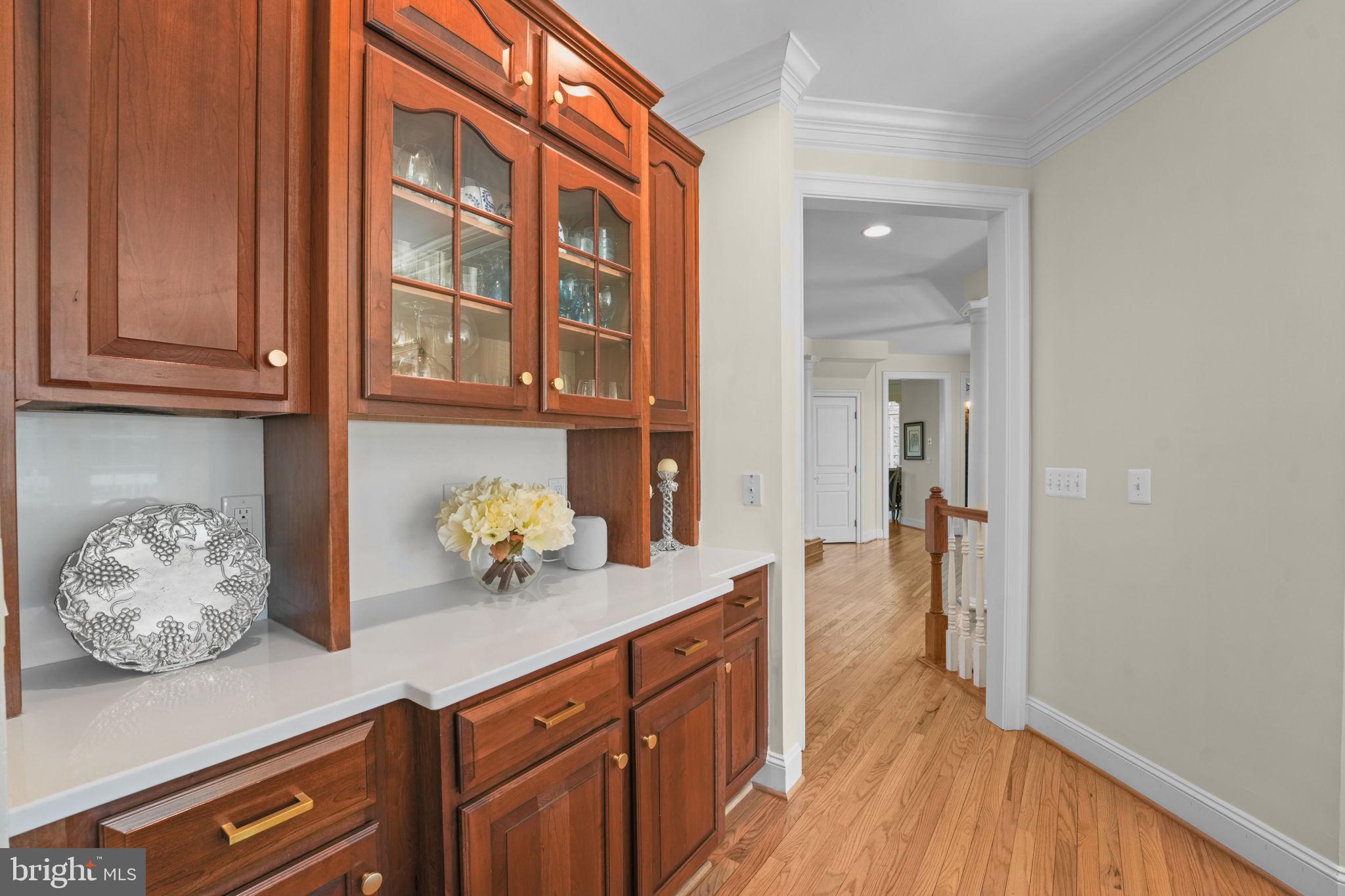 11431 Woolington Road Great Falls, VA 22066 - Photo 14 of 49 a kitchen with stainless steel appliances a counter space and wooden floor