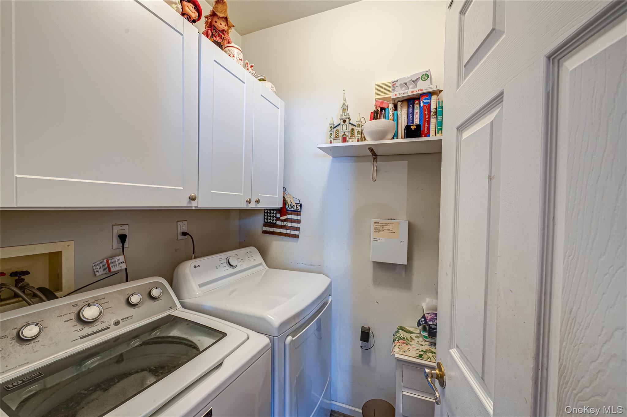 408 Leisure Drive Ridge, NY 11961 - Photo 13 of 17 a utility room with dryer and washer