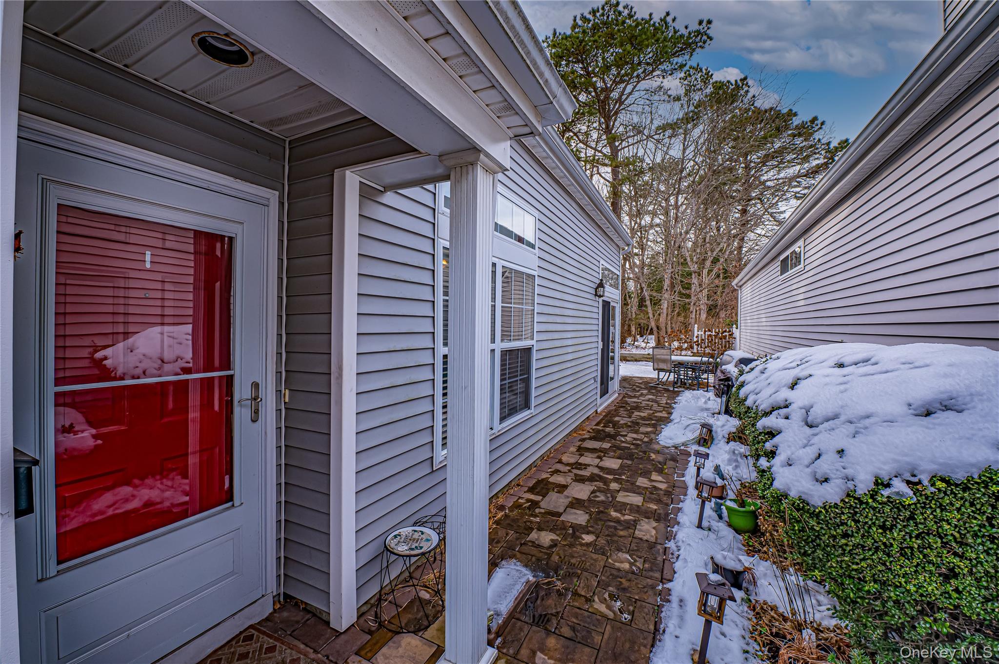 408 Leisure Drive Ridge, NY 11961 - Photo 14 of 17 a view of a pathway of a house with wooden fence