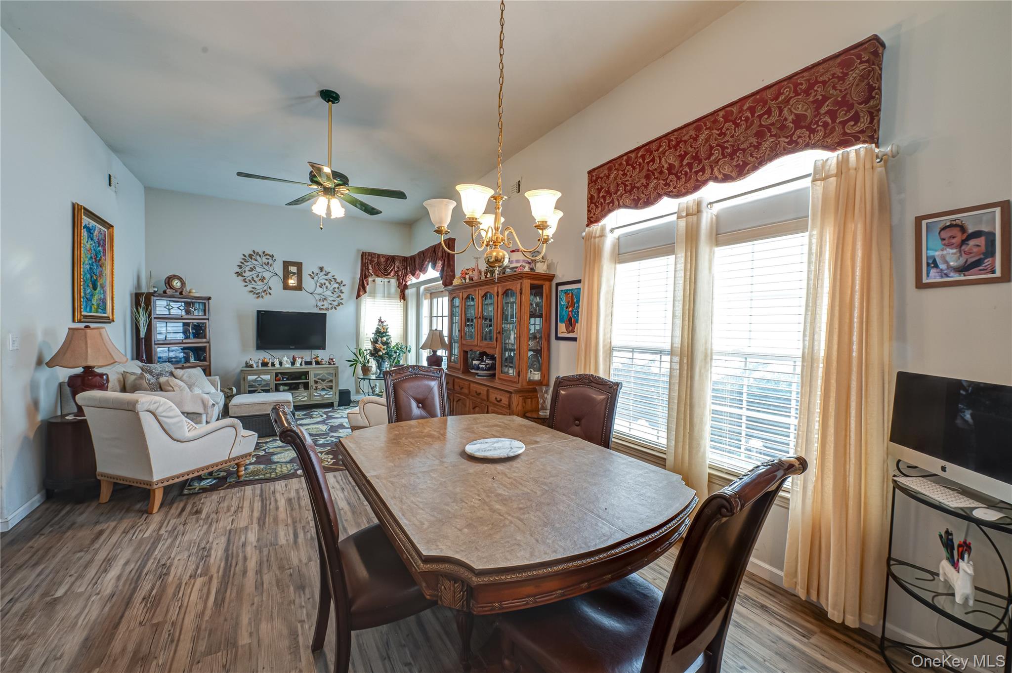 408 Leisure Drive Ridge, NY 11961 - Photo 4 of 17 a view of a dining room with furniture window and wooden floor