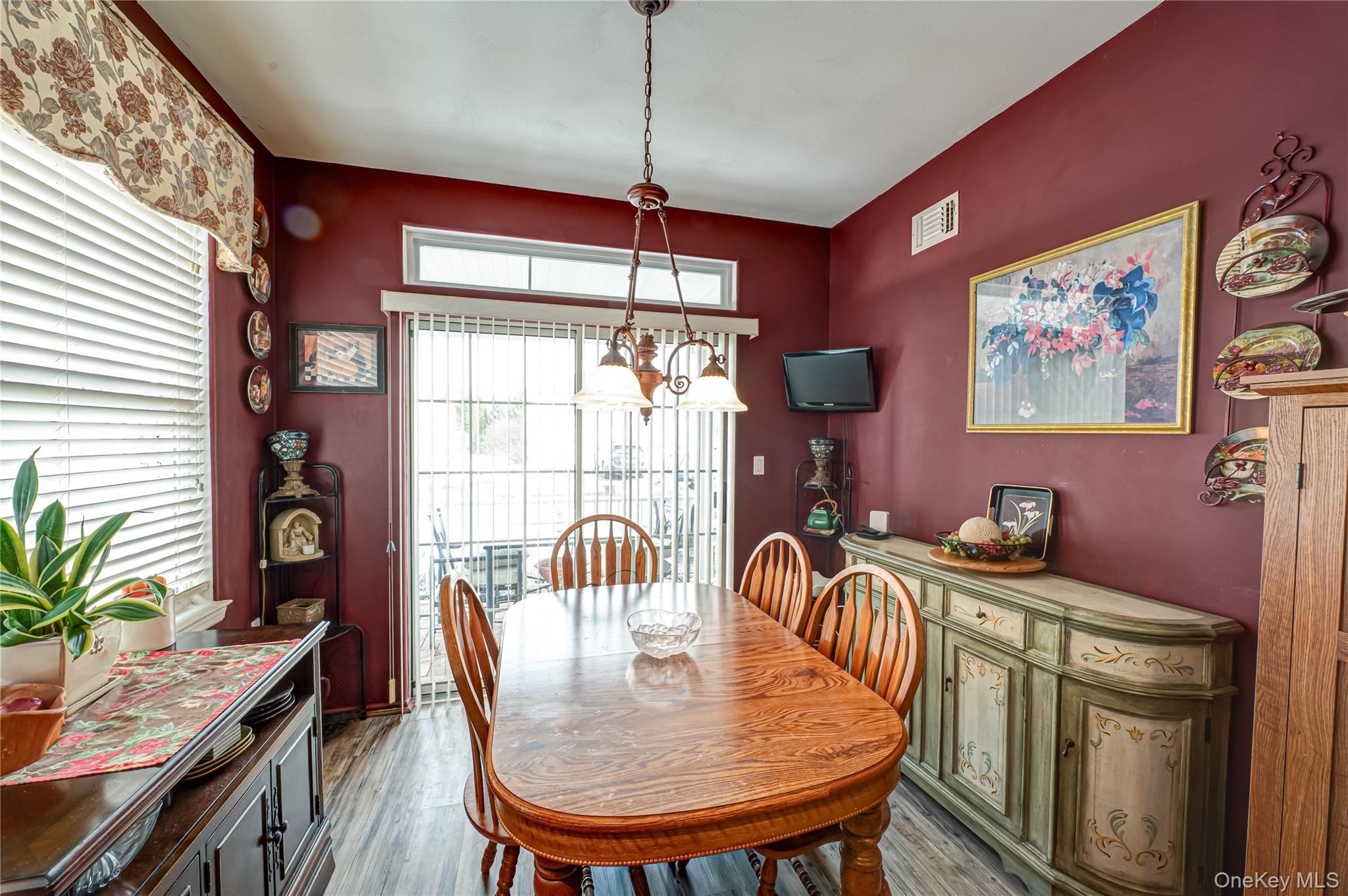 408 Leisure Drive Ridge, NY 11961 - Photo 8 of 17 a dining room with furniture and window