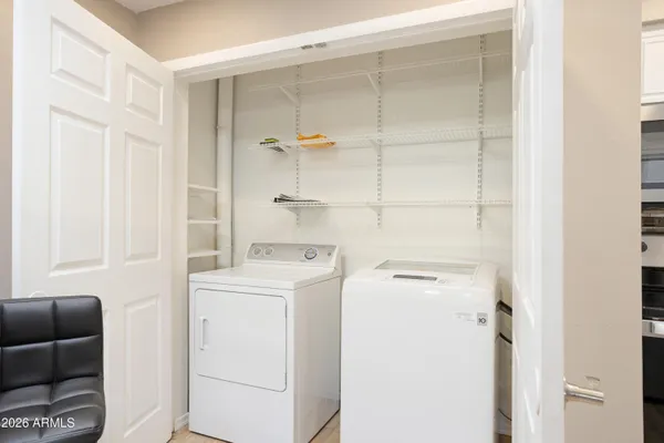 a room with lots of chairs and mirrors