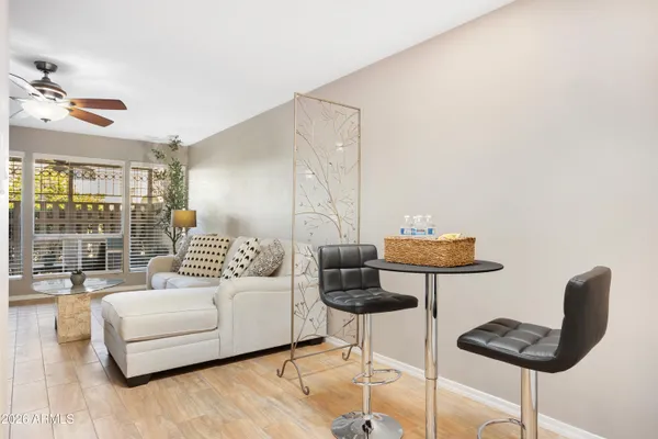 a living room with furniture and a large window