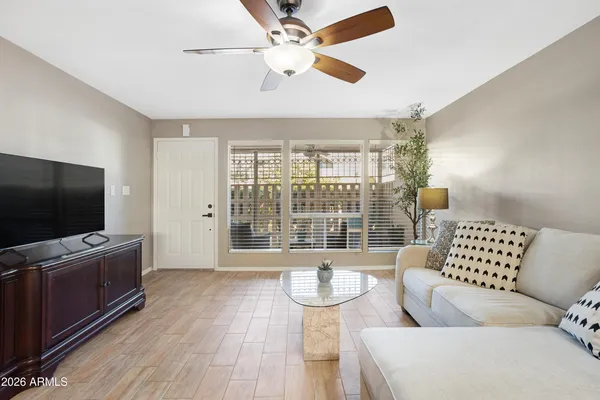 a living room with furniture and a flat screen tv