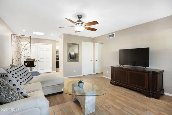 a living room with furniture and a flat screen tv