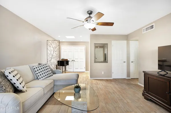 a living room with furniture and a flat screen tv