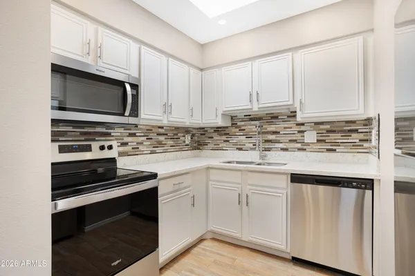 a swimming pool with outdoor seating and yard