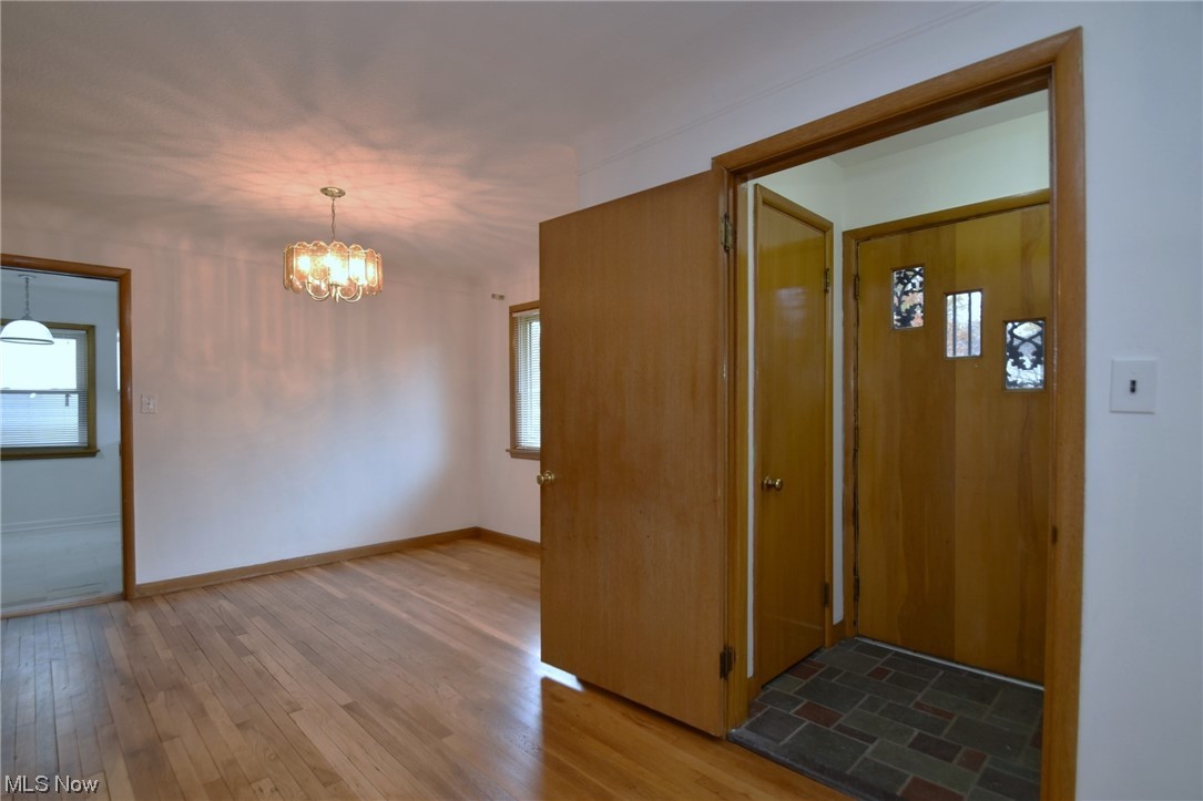 3681 Brinkmore Road Cleveland Heights, OH 44121 - Photo 3 of 27 Entrance foyer featuring dark hardwood / wood-style floors and a notable chandelier