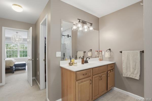 29 Hickory Hill Road Newburgh, NY 12550 - Photo 33 of 47 a en suite bathroom with a double vanity sink a mirror and a shower