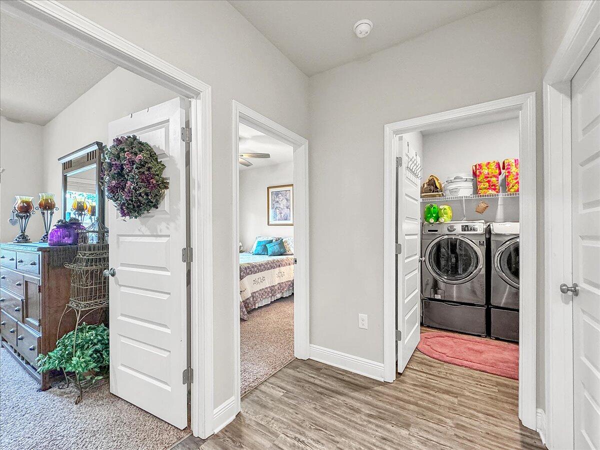 3568 Moonstone Drive Navarre, FL 32566 - Photo 14 of 39 a view of a hallway to a livingroom with furniture