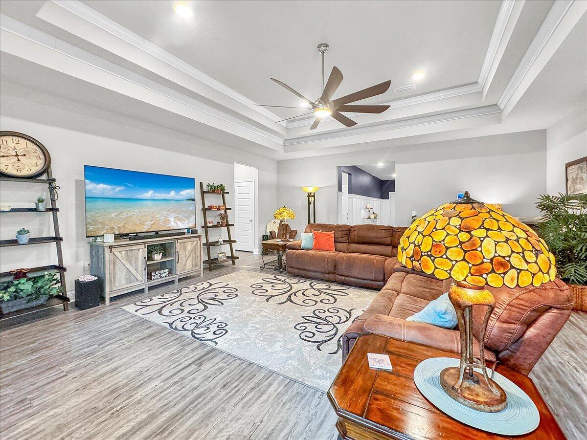 3568 Moonstone Drive Navarre, FL 32566 - Photo 22 of 39 a living room with furniture and a flat screen tv